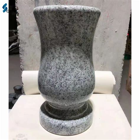 1. Granite Gravestones with Vases: