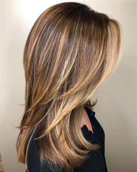 1. Long, Layered Blonde Hair with Caramel Highlights