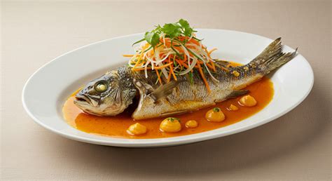 1. Steamed Fish (Symbolizes Abundance and Prosperity)