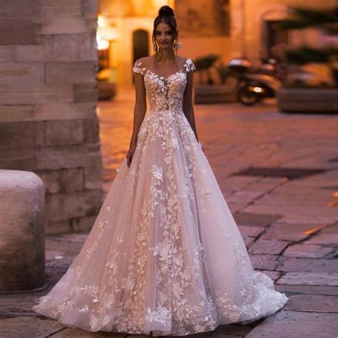 10 Enchanting Engagement Party Dresses for the Radiant Bride-to-Be