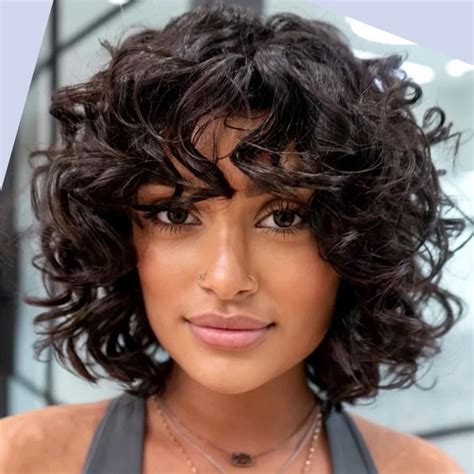 55 Epic Women's Haircuts for Curly Hair: Style Guide + Tips