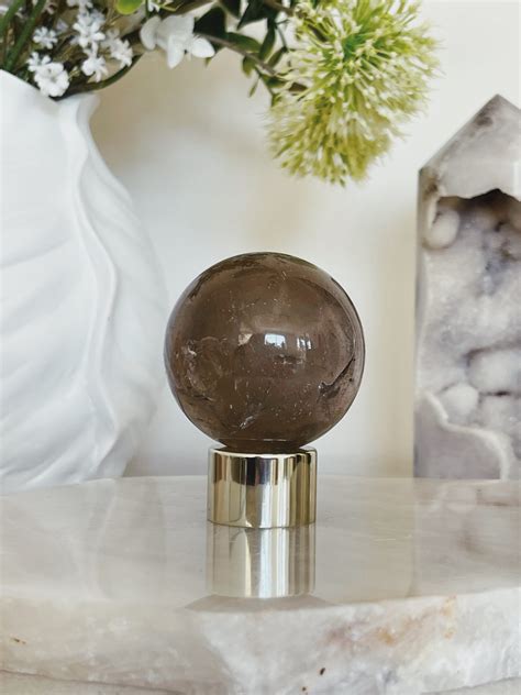 A Journey Through Time: Unveiling the Smoky Quartz Sphere's Heritage