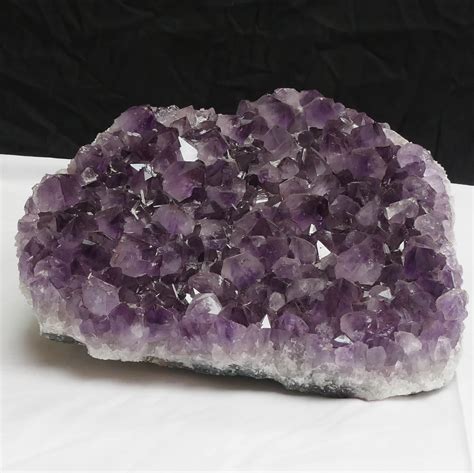 A Spectacular Masterpiece: The Enchanting Beauty of a Large Amethyst Cluster