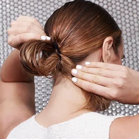 Avoid hairstyles that pull the hair back from the forehead.