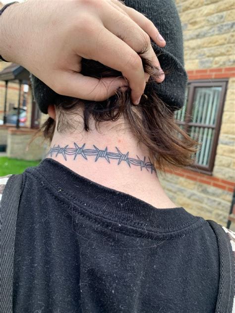 Barbed Wire Neck Tattoo: A Symbolism of Resilience, Pain, and Strength