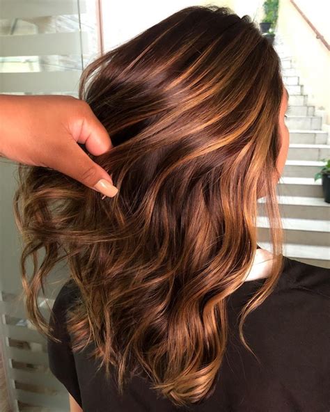 Blonde Highlights with Caramel Nuances: A Timeless Allure for Brunettes