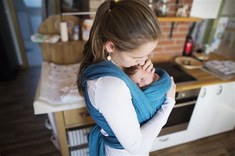 Carrying the baby around the house