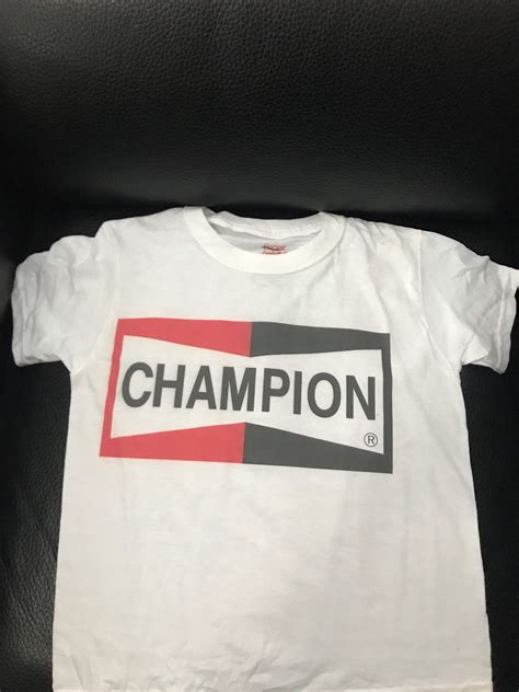 Champion Spark Plug T-Shirt: A Spark of Style and Heritage