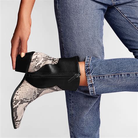 Conquer the Style Savanna with the Enchanting Allure of Snake Print Boots