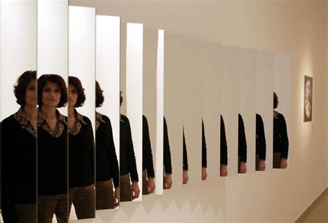 Create a series of mirrors and screens to create the illusion of a solid wall.