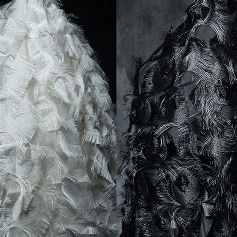 Dark, feathered fabric: