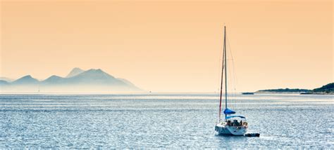 Eco-Friendly Boating Practices illustrated with a clean UK harbour view