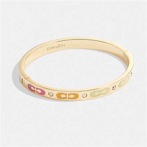 Elegance and Versatility: The Essence of Coach Bangles