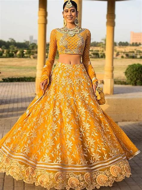 Embrace the Enchanting Allure of Mehndi Outfits for Brides Online