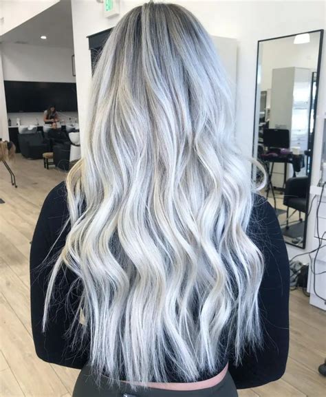 Embrace the Platinum Perfection with Dark Rooted Waves