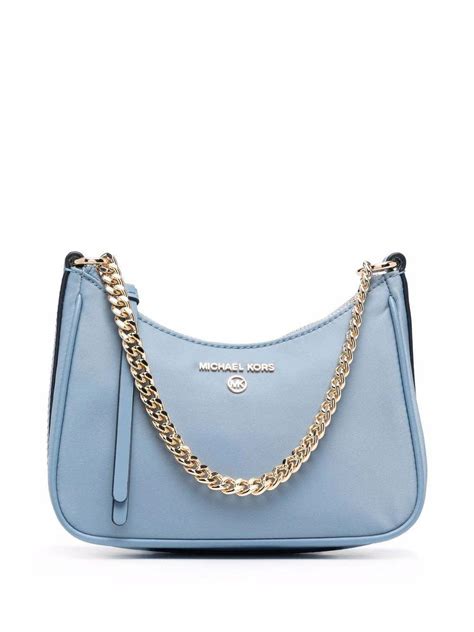 Embrace the allure of the iconic blue MK bag, a symbol of sophistication and timeless style.