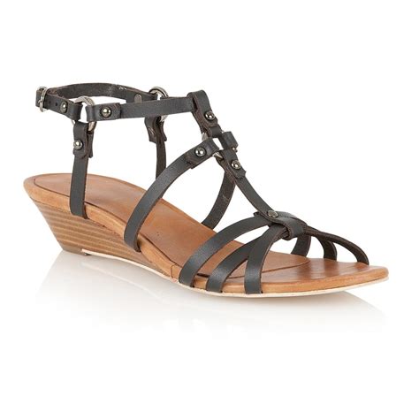 Embracing Versatility and Style: A Comprehensive Guide to Strappy Wedge Sandals