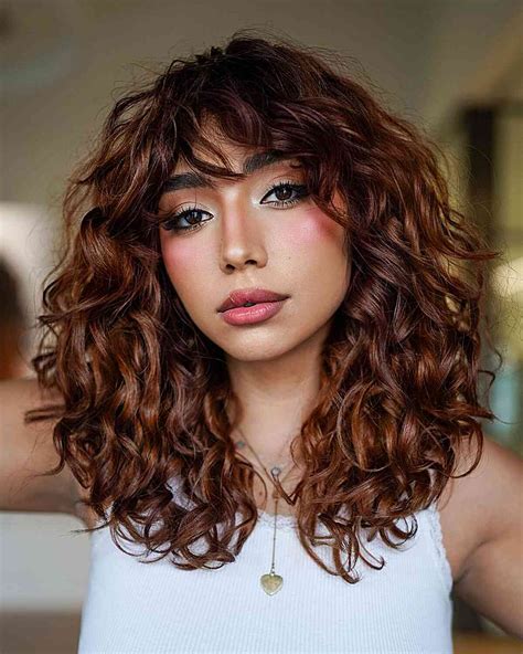 Embracing the Contrast: A Comprehensive Guide to Styling Curly Hair with Straight Bangs