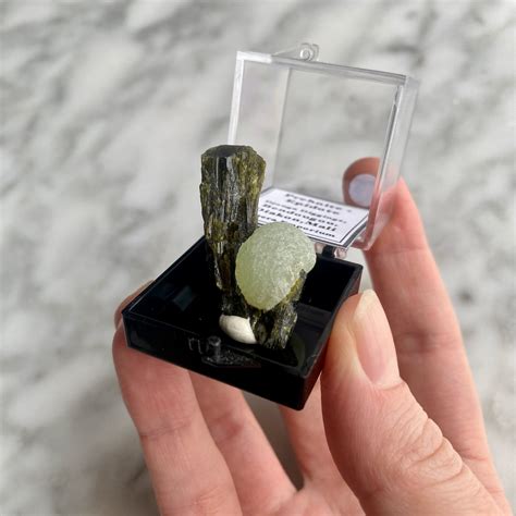 Epidote with Prehnite: A Unique Gemstone with Enchanting Qualities