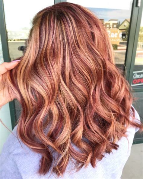 Fiery and Fabulous: Embrace the Allure of Red with Blonde Highlights