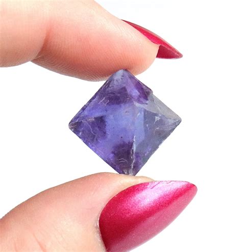 Fluorite's Enchanting Octahedron: A Versatile Gem with Infinite Possibilities