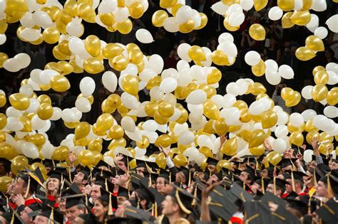 Graduates in caps and gowns celebrating at a Georgia Tech commencement event