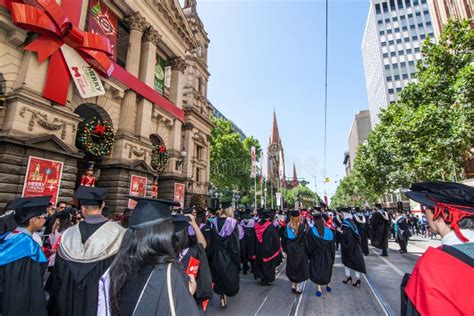 Students celebrating graduation with family and friends in Australia
