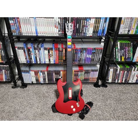 Guitar Hero on Real Guitar: Transforming Virtual Virtuosity into Tangible Talent