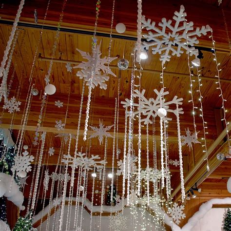 Hang snowflake lights from the ceiling.