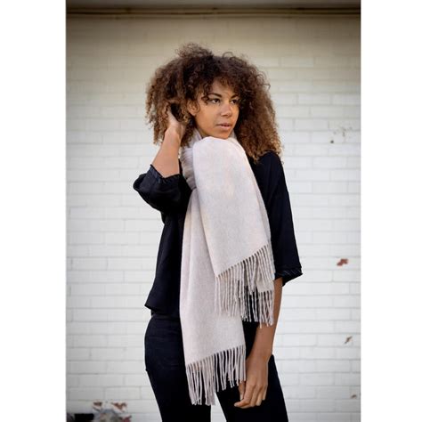 Indulge in the Cozy Embrace of Woolen Ladies Scarves: A Guide to Warmth, Style, and Versatility