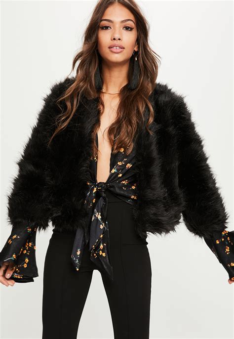 Indulge in the Sumptuous Comfort of a Black Faux Fur Ladies Jacket: A Timeless Style Essential