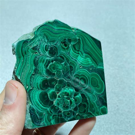 Malachite Crystals: Journey into the Enchanting Realm of Transformation and Protection