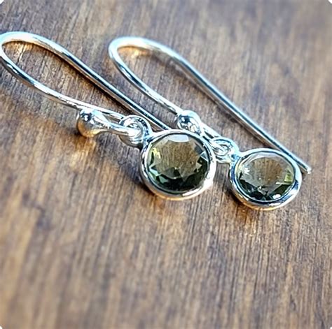 Moldavite Earrings: A Stunning Adornment with Captivating Metaphysical Properties