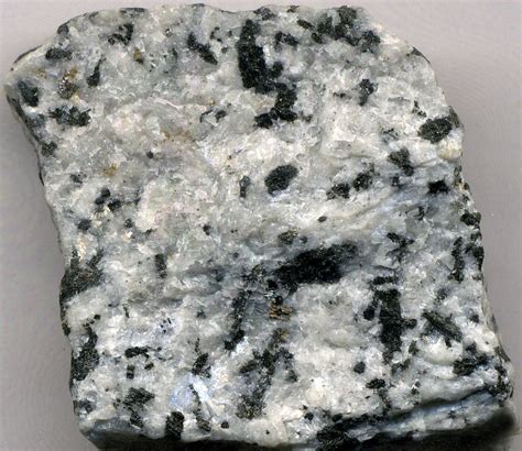 Origins and Composition of White Rock with Black Spots