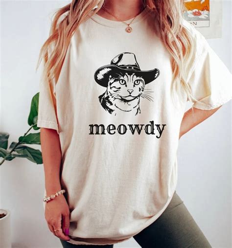 Origins of the Meowdy Partner Shirt