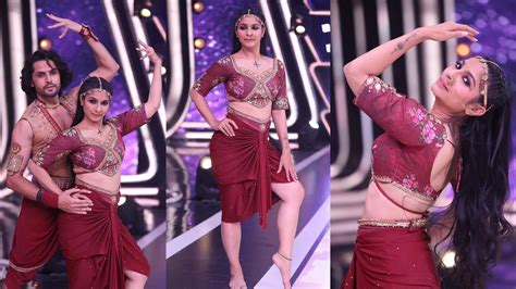 Prepare to be Dazzled: Jasmine Sets the Stage Ablaze in a Stunning Red Costume