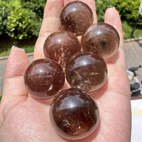 Smoky Quartz Sphere: The Enigmatic Orb of Protection and Transformation