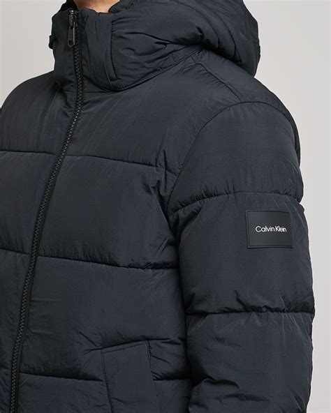 The Ultimate Guide to the Calvin Klein Black Puffer Jacket: A Comprehensive Exploration of Warmth, Style, and Functionality