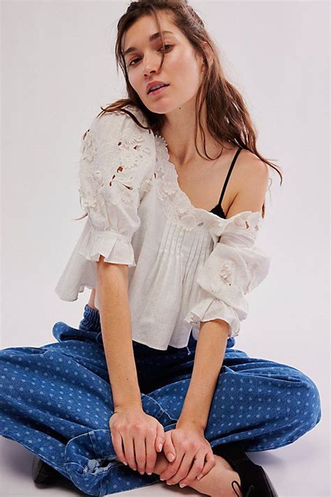 These loose-fitting tops feature billowy sleeves, intricate embroidery, and a relaxed silhouette.