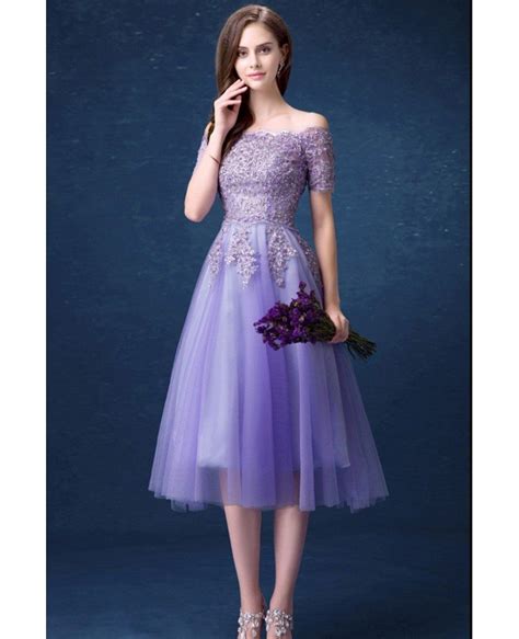 This off-the-shoulder lavender cocktail dress is perfect for a summer wedding or party.