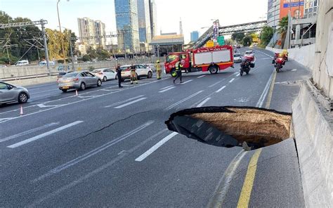 Truck Sinks into Massive Sinkhole on Highway, Causing Traffic Chaos