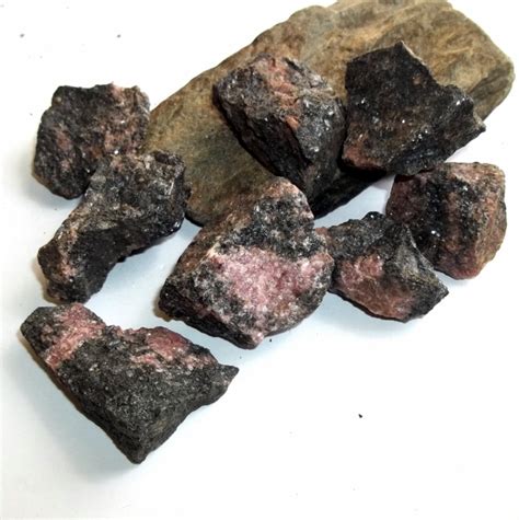 Uncover the Mystical Power of Rhodonite: A Raw Gemstone for Divine Connections