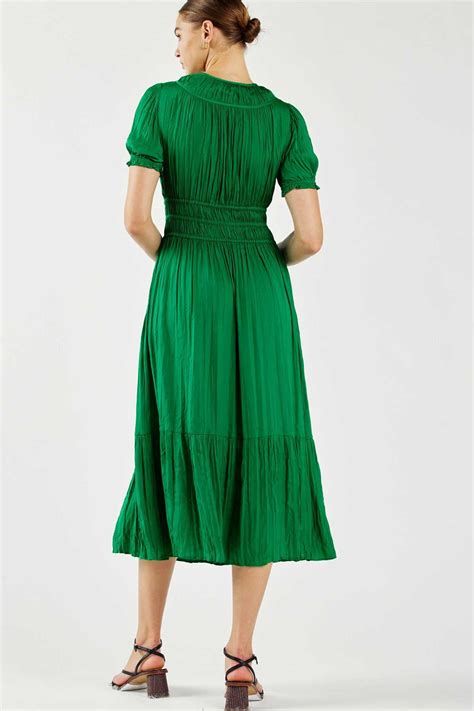 Understanding the Allure of Pleated Midi Dresses