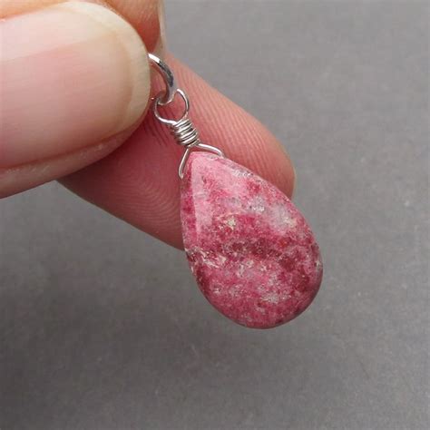 Unveil the Essence of Thulite: A Gemstone of Unrivaled Charm