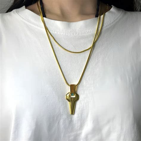 Unveiling the Symbolism and Significance of the David Martinez Necklace