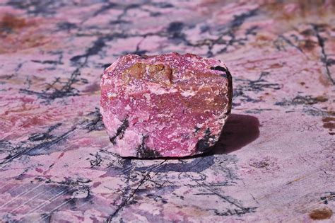 Unveiling the Therapeutic Essence of Raw Rhodonite