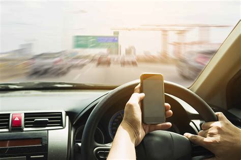 Using Mobile Phone While Driving: Demerit Points in Singapore