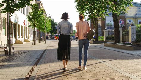 a woman walks down the street Epub