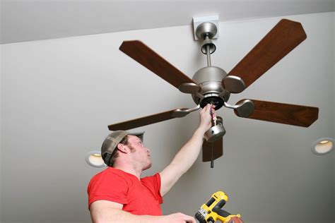 An angled ceiling fan mount installed on a sloped ceiling