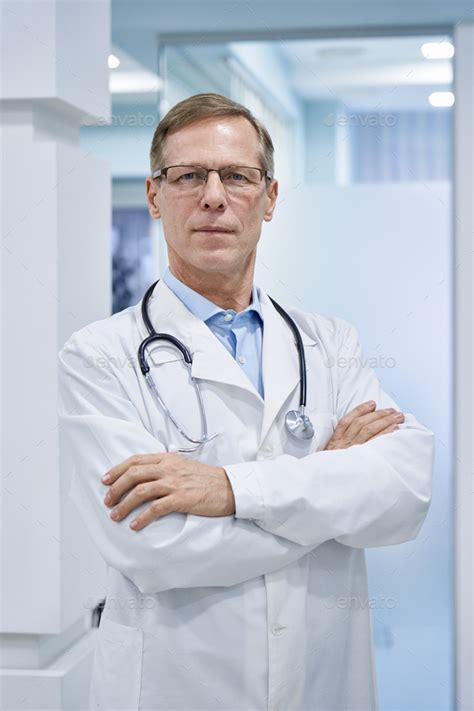 angry old doctor with arms crossed